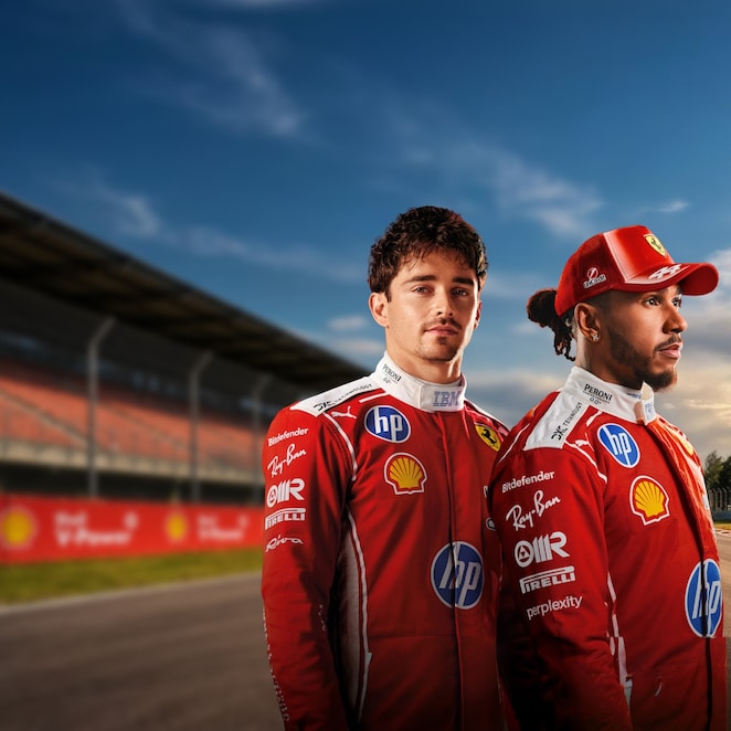 Lewis Hamilton and Charles Leclerc stand in front of an image of a race circuit.