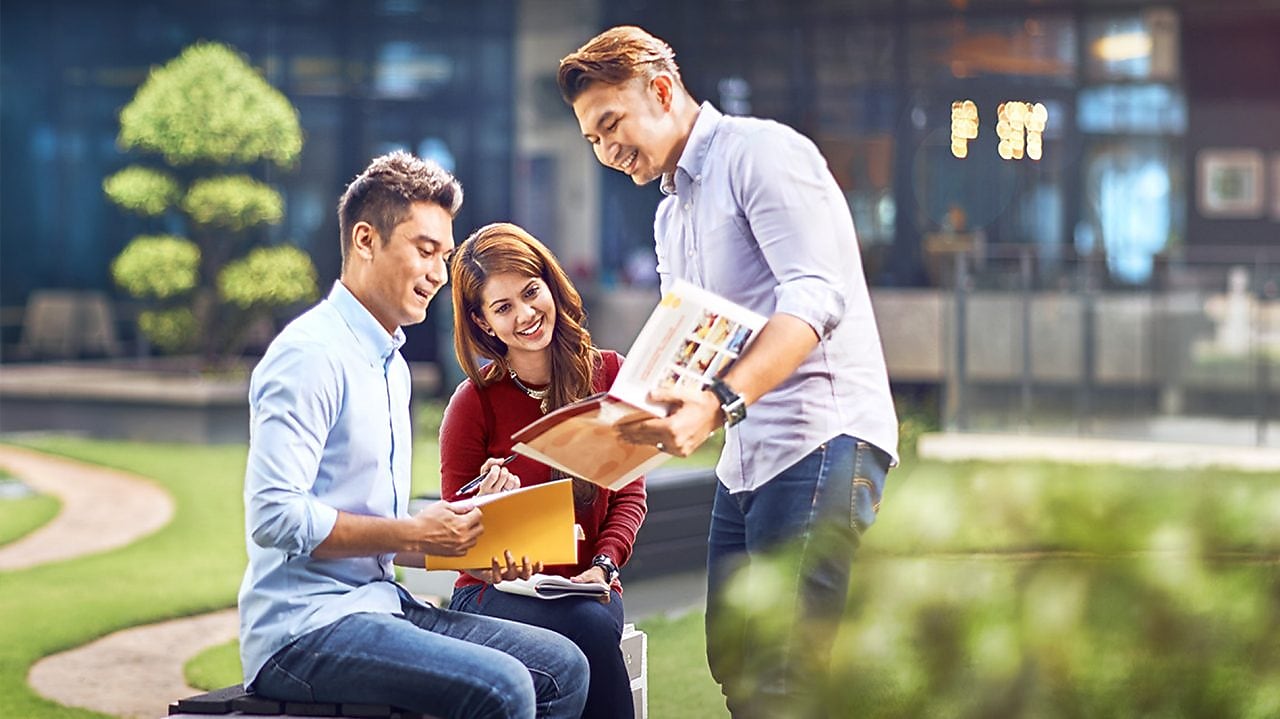 two colleagues discussing about a file