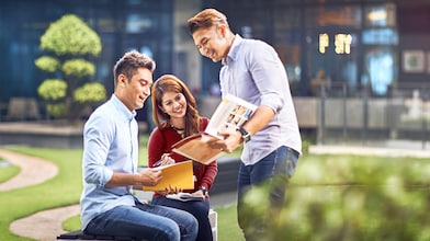 two colleagues discussing about a file