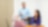 an employee standing is having an engaging conversation with his colleagues who are seated.
