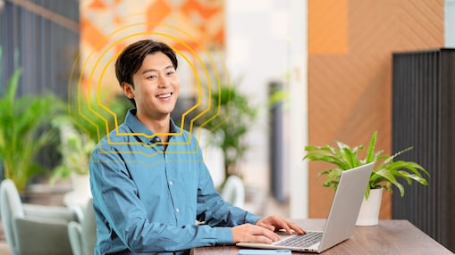male employee smiling while looking elsewhere