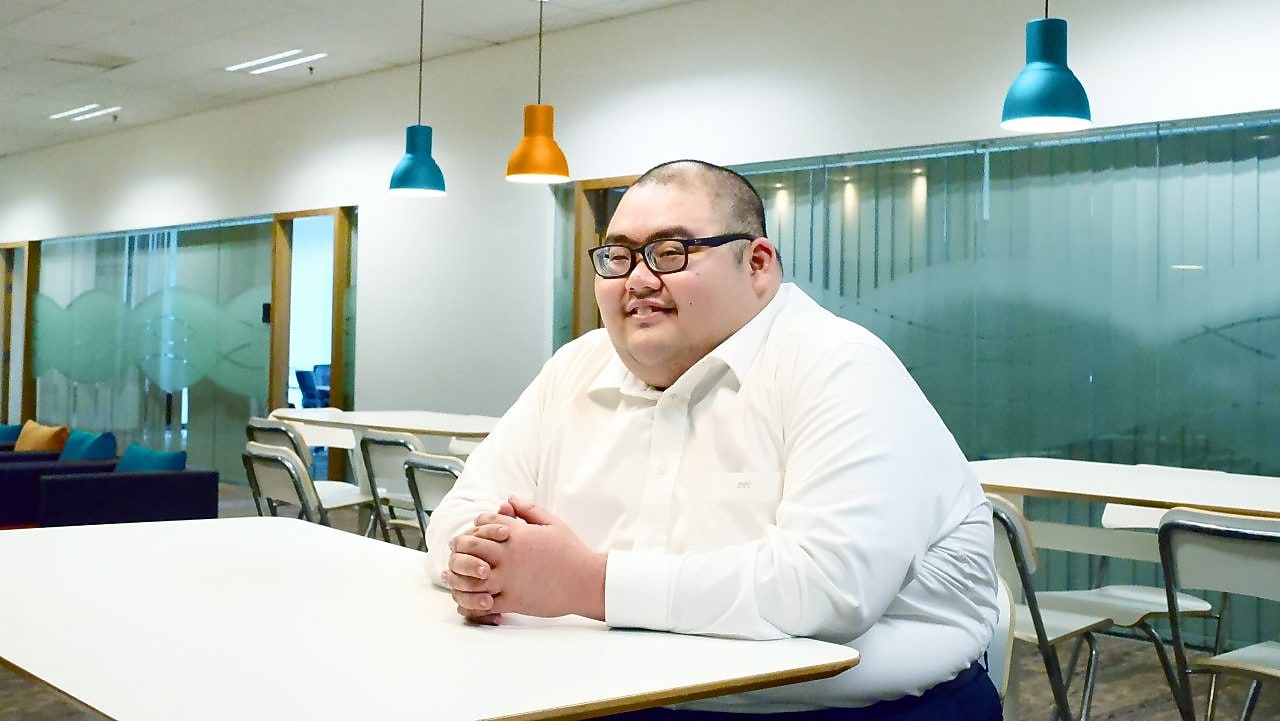 Bryan taking a break at the pantry at office.