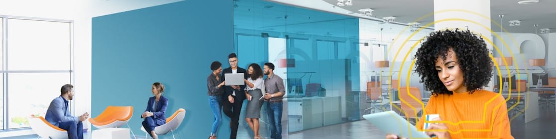 A woman buying online with her card through her Ipad while  at work.