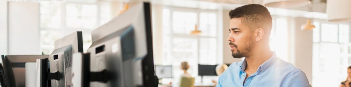 Men working on projects with computers.