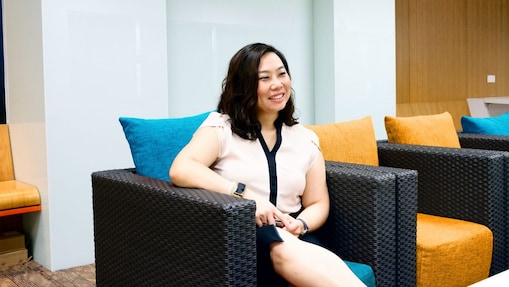 Ching taking a break at office as she sits and rests a bit.