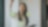 A woman placing post its on a glass wall