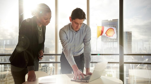 Shell intern discussing plans with his manager