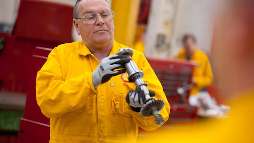 Worker inspecting a piece of equipment