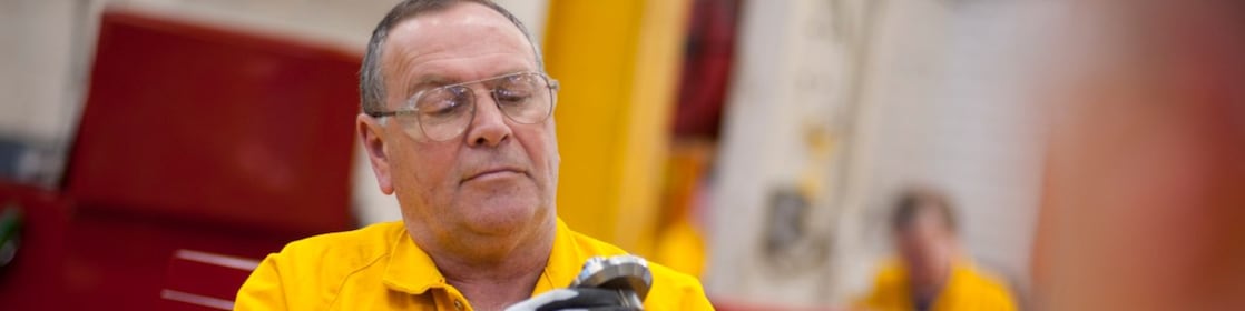 Worker inspecting a piece of equipment