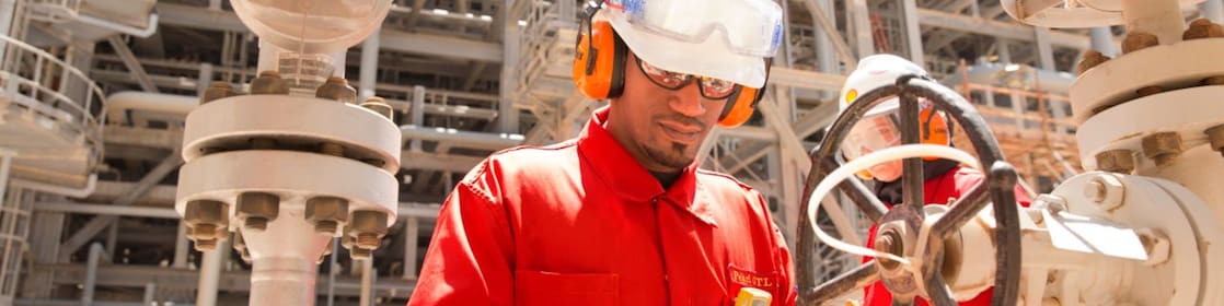 worker checking a valve