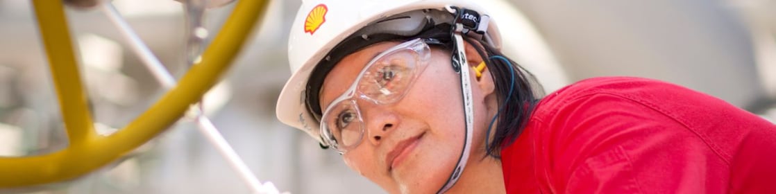 female employee inspecting equipment