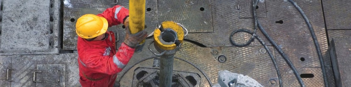 Man drilling in a rig