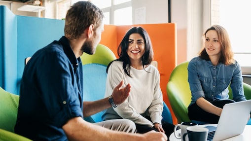 Three people discussing