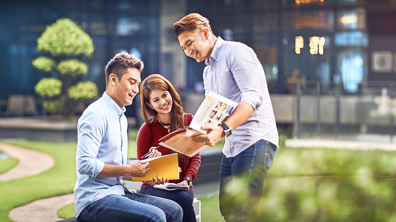 two colleagues discussing about a file