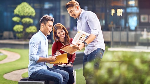 two colleagues discussing about a file