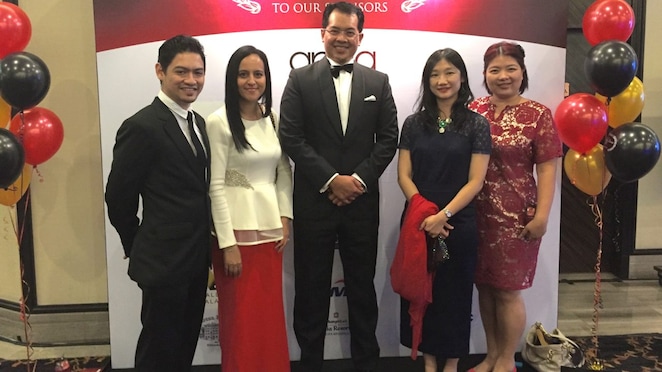 Fazilah and colleagues smartly dressed at an industry dinner