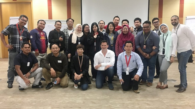 Maria and a group of colleagues pose after an event