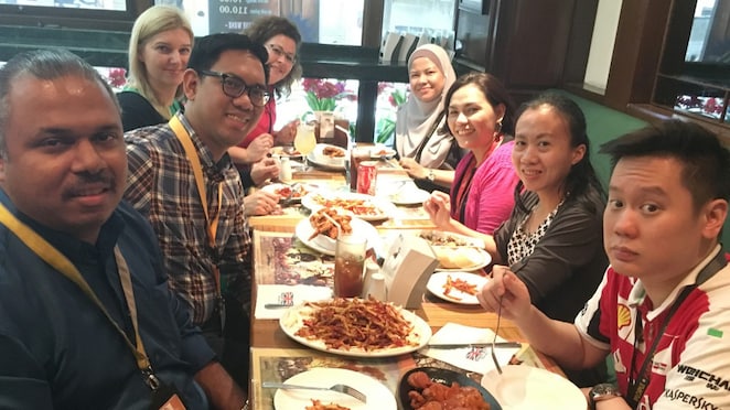 Maria and colleagues having dinner in a restaurant in Manila