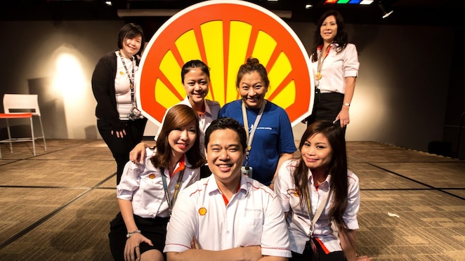 Siew Yen and colleagues pose in front of the Shell pecten