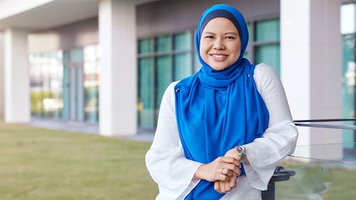 Maria posing in front of a building
