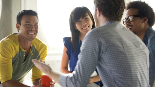 Colleagues collaborating in a relaxed office environment
