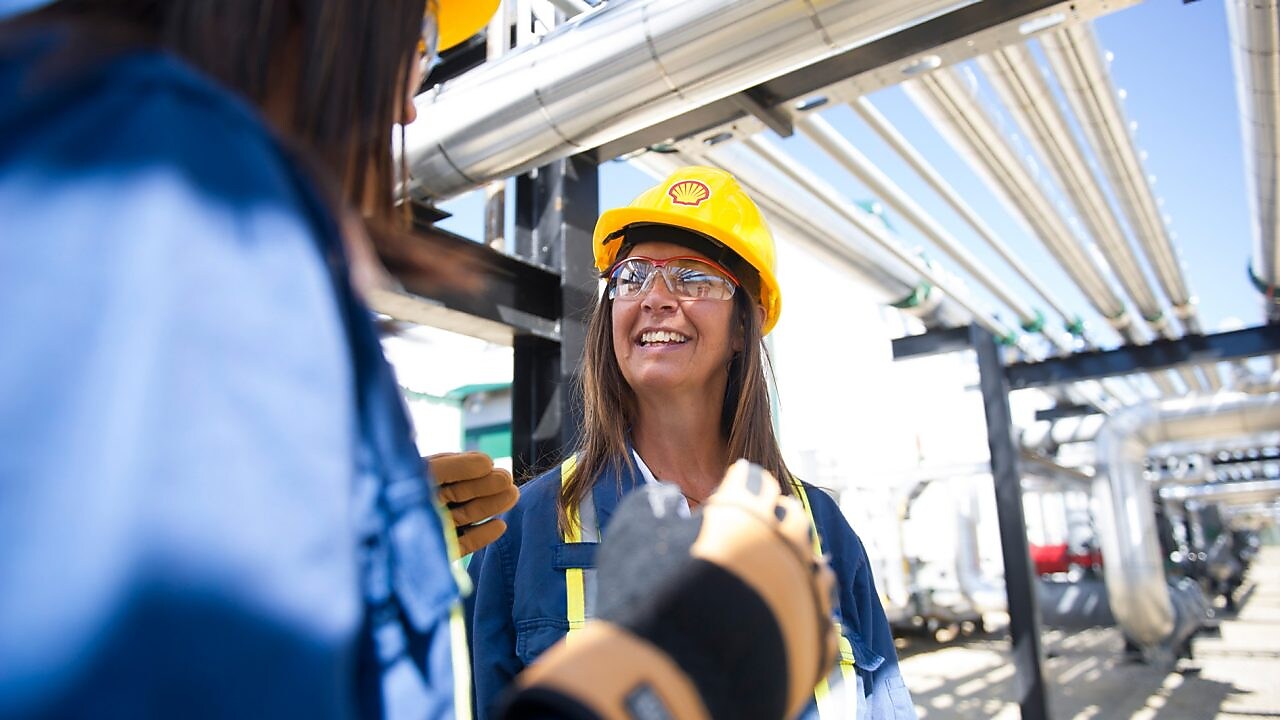 Female colleagues on site talking and smiling