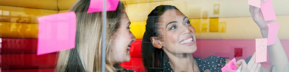 Female workers discussing work in dymanic work environment