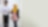 Employees walking and talking in corridor with iPad