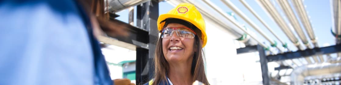 Female colleagues on site talking and smiling