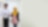 Employees walking and talking in corridor with iPad
