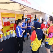Visitors at a Shell booth