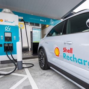 An EV parked at a Shell Recharge High-Performance Charging bay