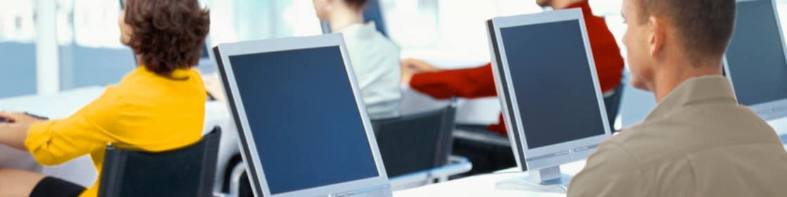 People working and looking at computer monitors