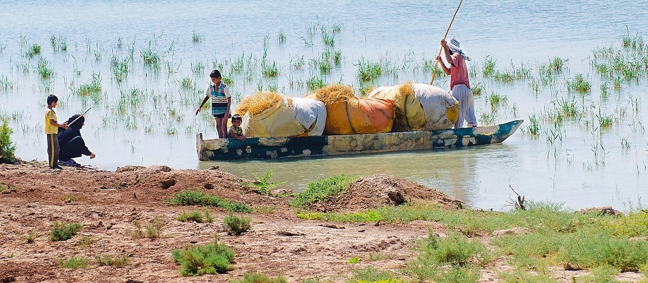 Local people on the Yabani Canal in the South of Iraq