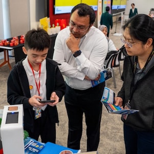 Team Theory from SMK Bandar Bintulu demonstrating their project to Shell Mentor, Haja Muhaideen, during Shell NXplorers Malaysia Sarawak Finals