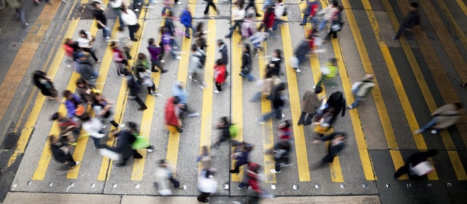 People crossing a busy street in Hong Kong