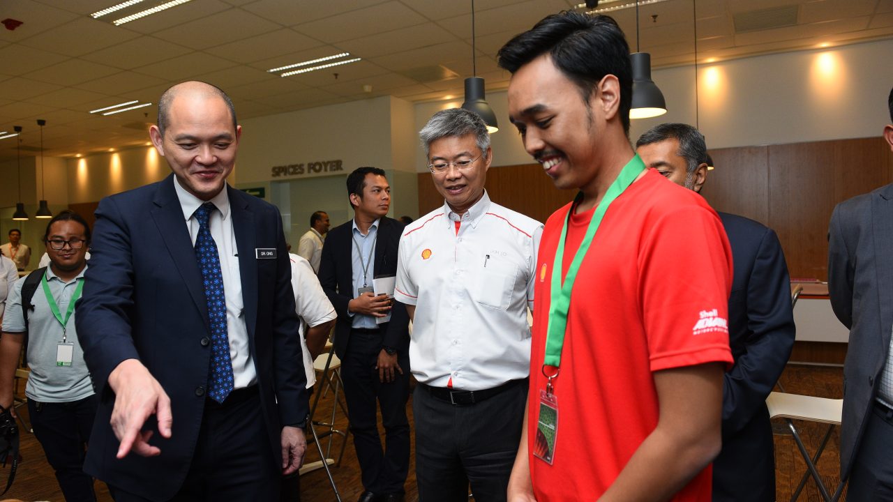 Team UPM Serdang showcasing their prototype with YB Dr Ong Kian Ming