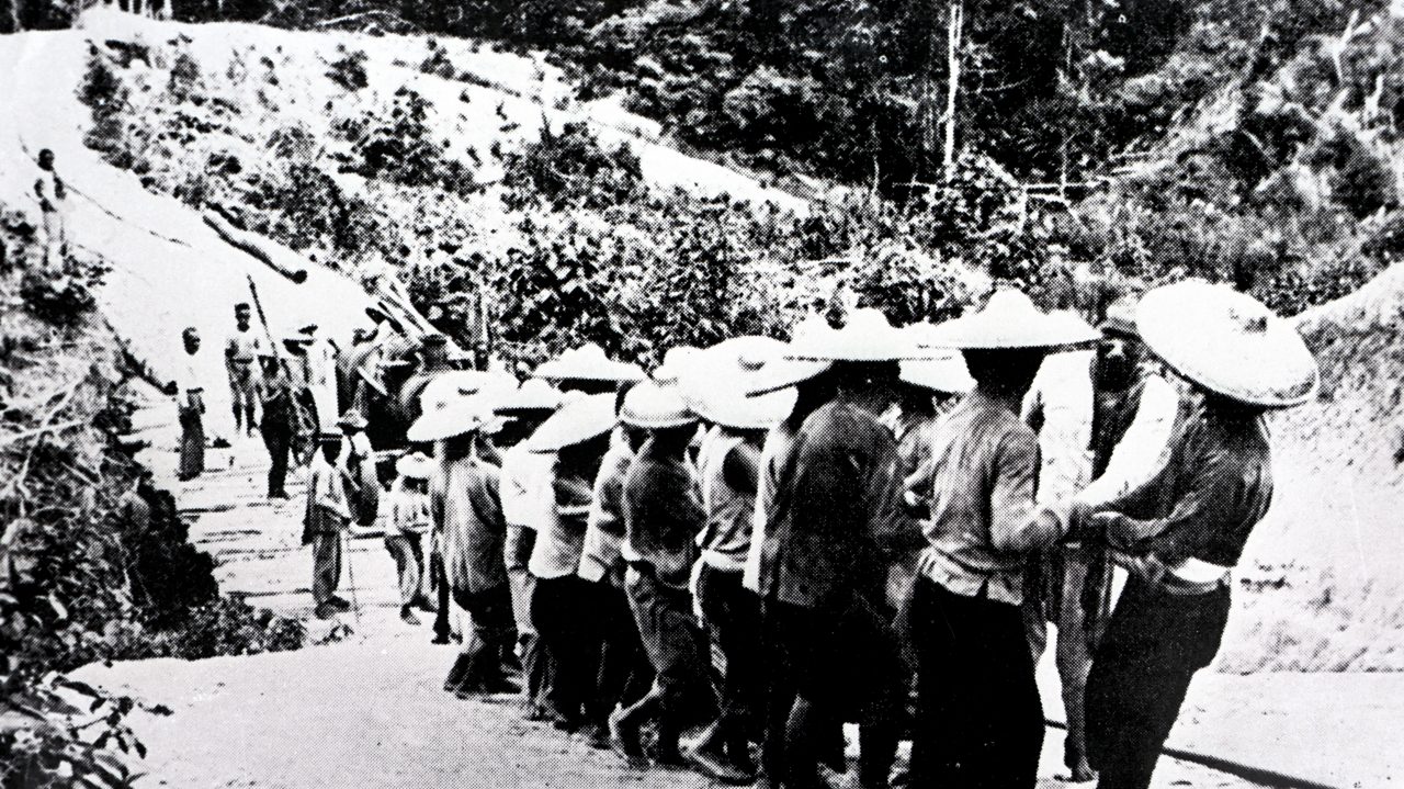 Coolies hauling a boiler uphill, 1911. In the early years, the Company had to rely very much on human power. 