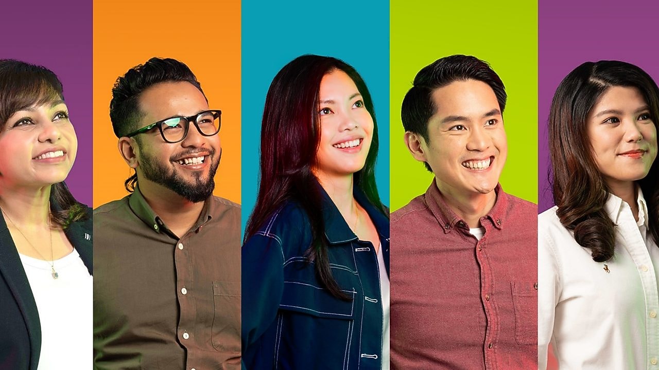 Businesswoman drawing graphs on glass