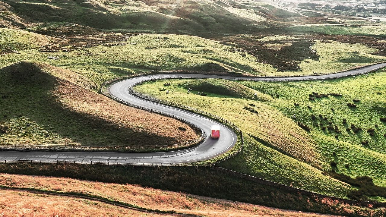 Truck driving down windy road
