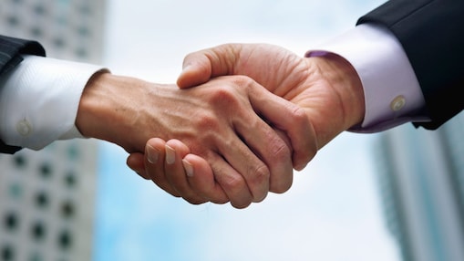 Two persons shaking hands