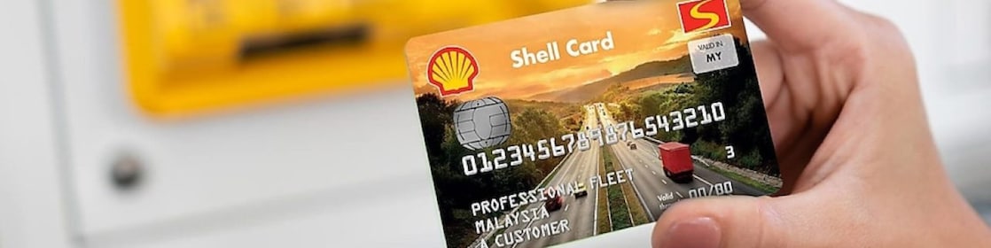 person holding Shell card