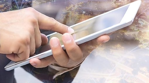 hands holding a tablet