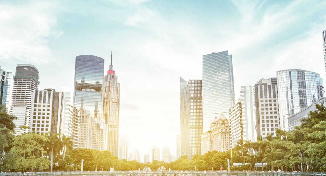 modern square and skyscrapers under sunbeam