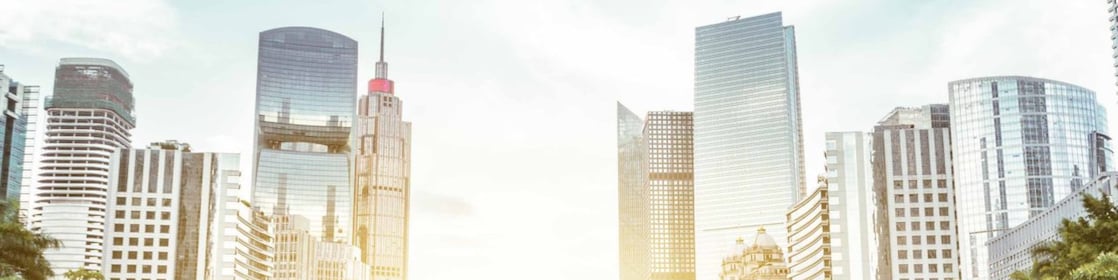 modern square and skyscrapers under sunbeam