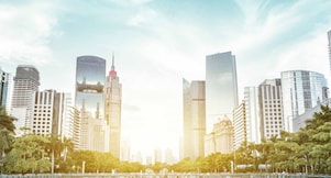 modern square and skyscrapers under sunbeam