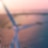Windmill surrounded by solar panels