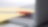 Photo of red pan on yellow piece of paper, placed on the keyboard of a laptop