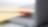 Photo of red pan on yellow piece of paper, placed on the keyboard of a laptop