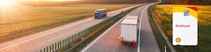 A truck and van on the road with the Shell Card held up in the foreground